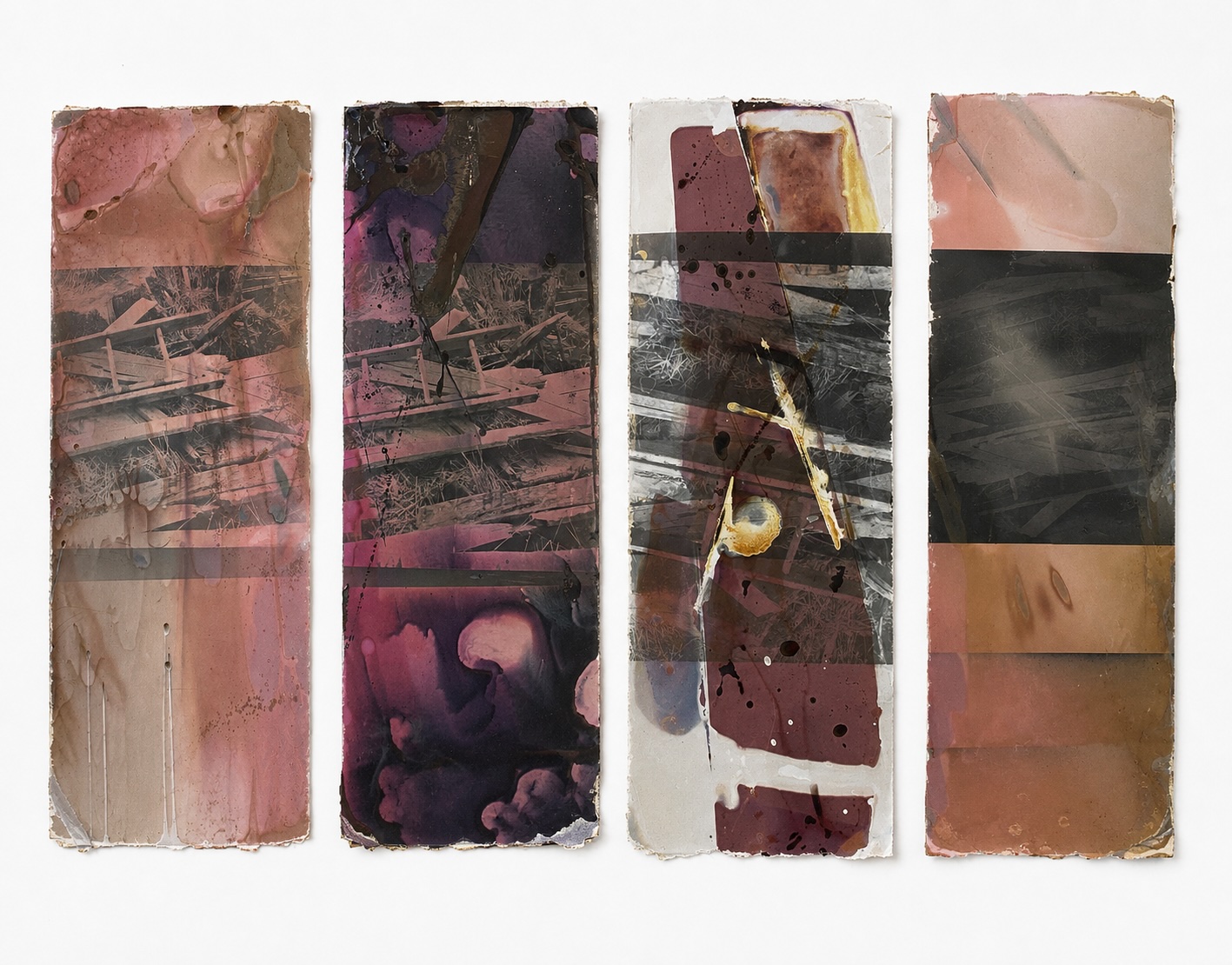 Four discarded darkroom test strips with chemical stains and damaged edges
